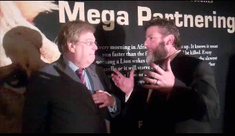 Martin talking with financial expert, Paul Bauer, Senior Research Economist